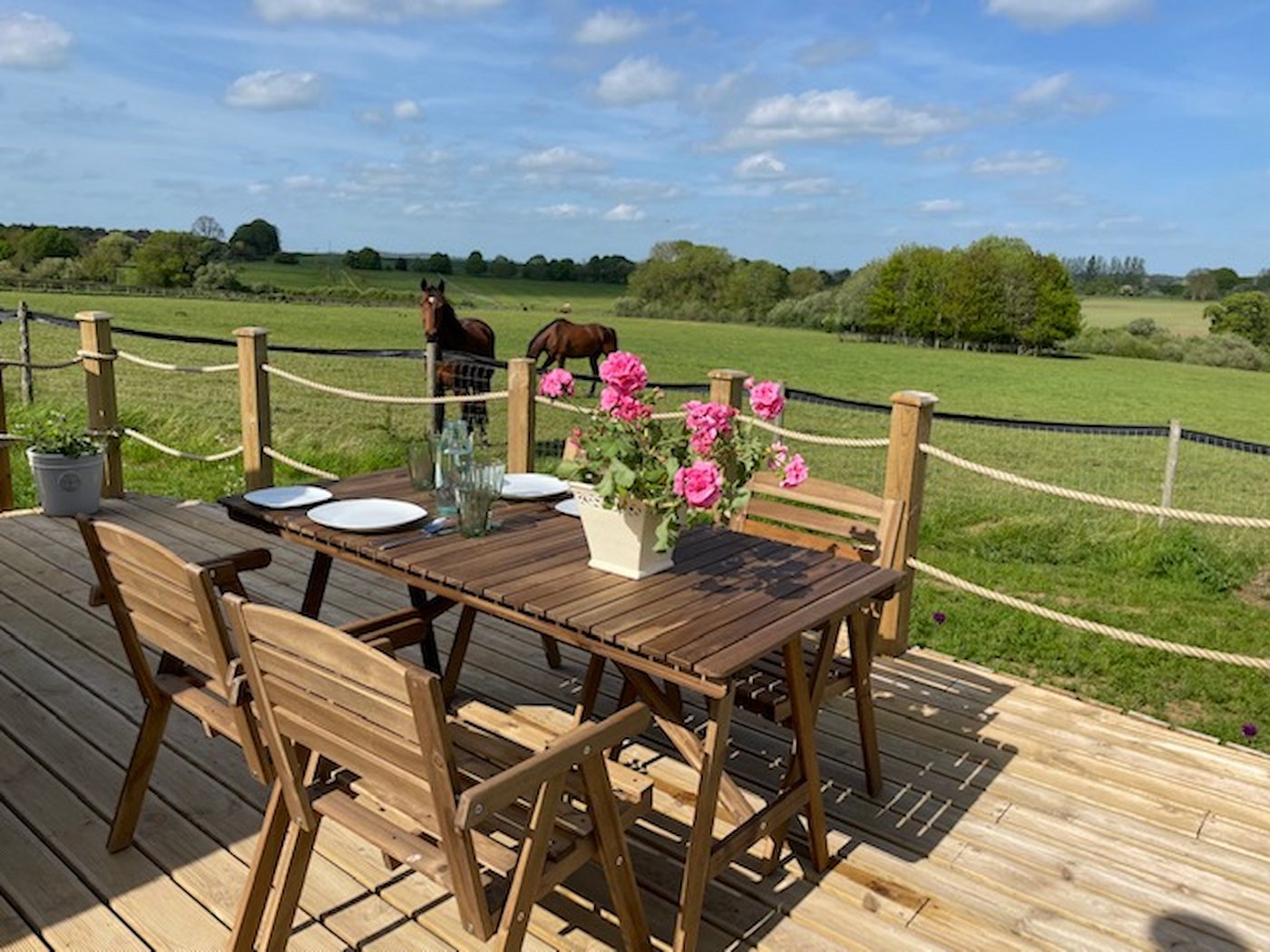Luxury Cabin Decking area with outdoor table and chairs, close to horse grazing